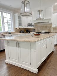 A Birchcraft Custom Granite Top Kitchen Island With Sink And Rohl Single Hole Bar Faucet