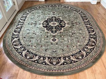 A Traditional Area Rug In Green, Oval (10'1' X 7'10')