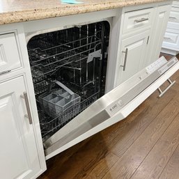 An Asko Dishwasher With Wood Panel