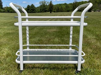 A Vintage Tubular Aluminum And Tempered Glass Bar Cart By Winston
