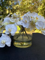 White Silk Flowers In Clear Acrylic Vase