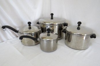 A Grouping Of Farberware  Pots With Lids