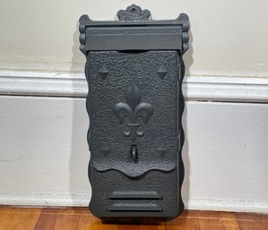 A Vintage Cast Iron Mailbox