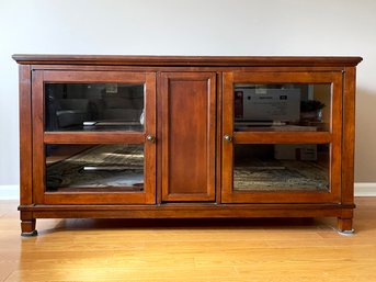 A Fine Quality Media Console With Glass Doors