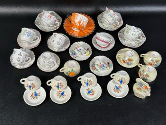 A Large Assortment Of Tiny Children's Teacups & Saucers