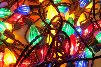 A Strand Of Large Multi Colored Holiday Lights -in Working Condition