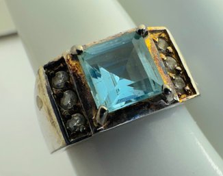 SIGNED FAS STERLING SILVER BLUE TOPAZ AND WHITE STONE RING