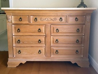 A Bleached Oak Dresser With Marble Top By Hooker Furniture