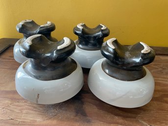 Four Vintage Ceramic Insulators.