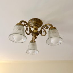 A Victorian Style Three Light Brass Ceiling Fixture With Ribbed Glass Shades