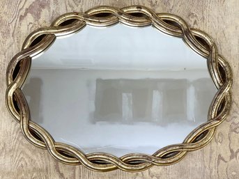 An Oval Mirror In Woven Gilt Wood Frame By Uttermost