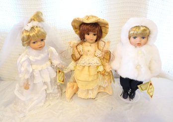 3 Collectors Choice Of Dolls On Stands