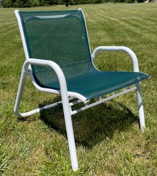 A Vintage Tubular Metal And Mesh Outdoor Chair