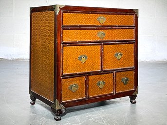 An Carved Rose Wood Nightstand With Faux Bamboo Motif And Caned Panels In Campaign Style