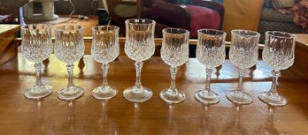 7 Small And One Large Cristal DArques Crystal Footed Glasses