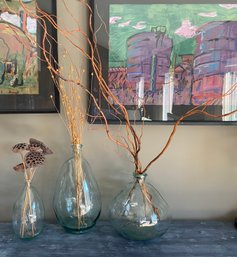 Three Large Glass Bottles With Dried Plant Inserts