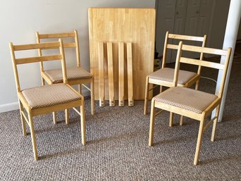 A Modern Oak Dining Table And Set Of 4 Chairs