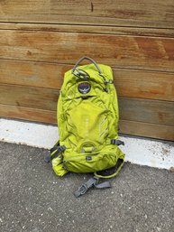 An Osprey Raptor 10 Backpack - Used