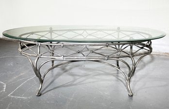 A Glass Top Coffee Table With Wrought Iron Base