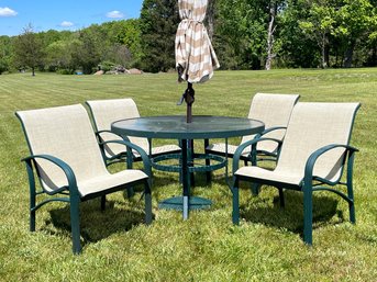 A Tubular Metal And Tempered Glass Outdoor Dining Set With An Umbrella, Base, And 4 Chairs
