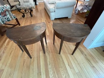 A PAIR OF ANTIQUE DEMILUNE SIDE TABLES