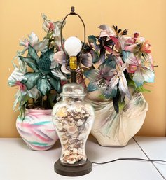 A Glass Lamp With Seashell Collection And Two Vintage 1980's Vases And Floral Arrangements