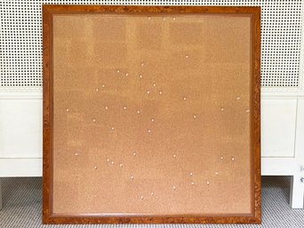 A Large Cork Board In Burl Wood Frame