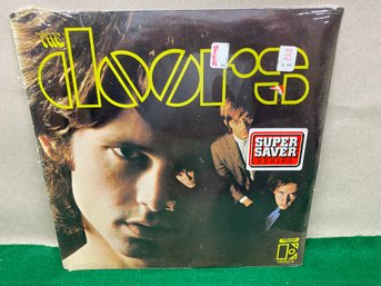 The Doors. First LP Record. Jim Morrison On 1967 Elektra Records. Sealed. Top Left Corner Shink Wrap Torn.
