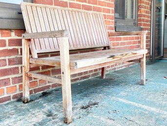 A Modern Teak Bench By Crate & Barrel