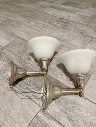 A Pair Of Polished Nickel Sconces With Frosted Glass Shades