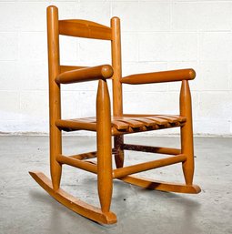 A Child's Oak Rocking Chair