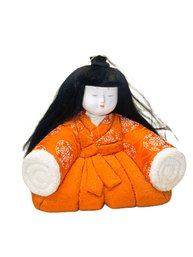 Small Asian Doll In Orange Kimono