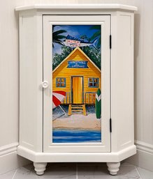 A Corner Cabinet With Painted Paneled Door - Coastal Themed