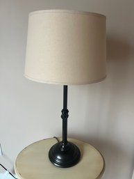 Pair Of Dark Metal Table Lamps With Ebony Finish And Natural Fabric Drum Shade