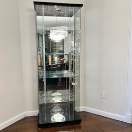 A Glass Curio Cabinet With LED Lighting