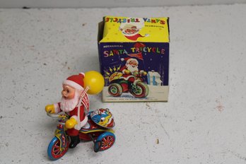 Vintage Mechanical Santa On Tricycle In Box. Made For Mccrory Corp In New York, PA. Tested And Works.