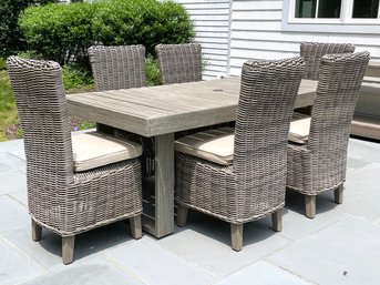 An Outdoor Teak Dining Table By West Elm And Set Of 8 Woven Chairs By Restoration Hardware