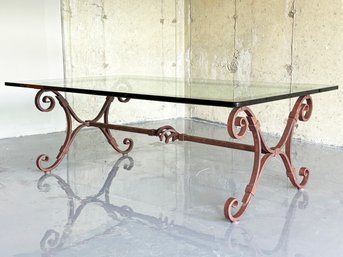 A Wrought Iron And Glass Coffee Table