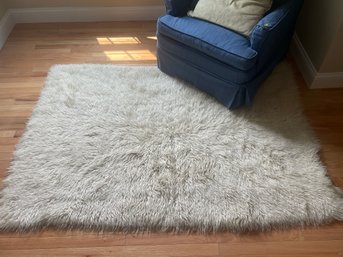 TWO FAUX FUR AREA RUGS