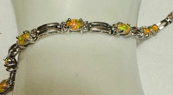 SIGNED FAS STERLING SILVER YELLOW OPAL AND DIAMOND ACCENT BRACELET