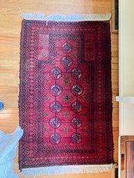 A PERSIAN AREA RUG