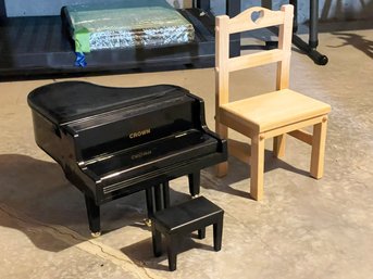 A Miniature Piano And Miniature Chair