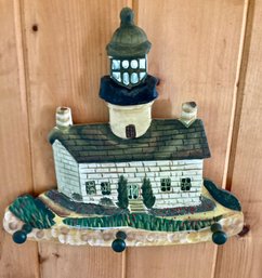 Wall Hook For Your Sweaters Depicting A Light House And 3 Hooks