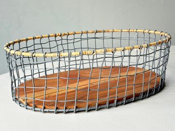 A Teak And Wire Mesh Basket
