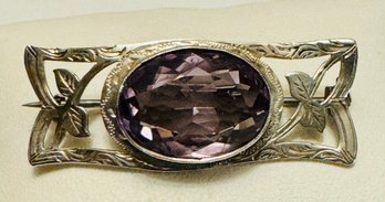 VINTAGE ETCHED STERLING SILVER AND FACETED OVAL AMETHYST BROOCH