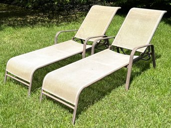 A Pair Of Outdoor Tubular Steel And Mesh Lounge Chairs