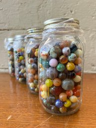 Four Large Jars Of Vintage Marbles