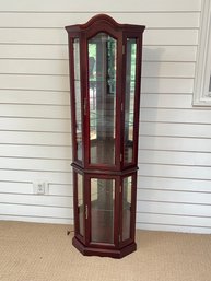 Nice Corner Curio Cabinet With Glass Shelves And Mirrored Back