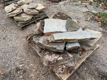 Two Piles Of Wall Stone On Pallets