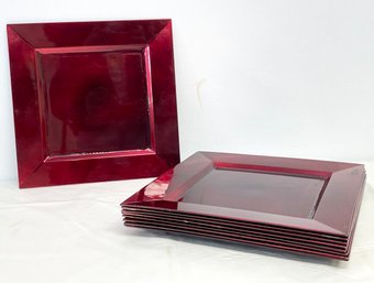 A Set Of 8 Burgundy Chargers